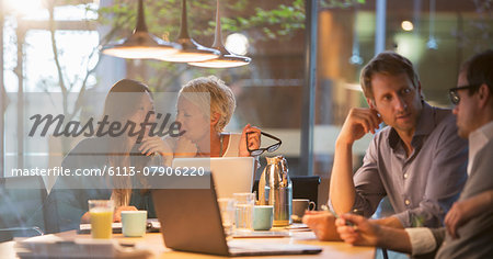 Businesswomen talking in office meeting