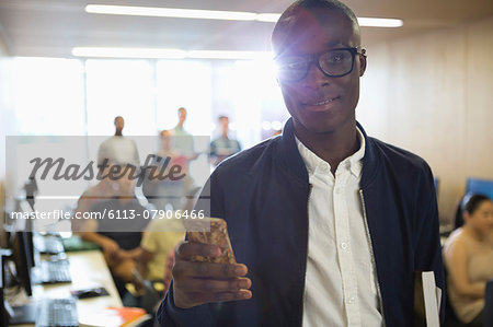 Portrait of university student with smartphone in classroom Portrait of university student with smartphone in classroom