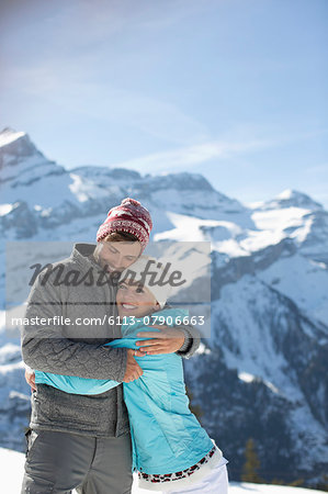 Couple hugging at mountains