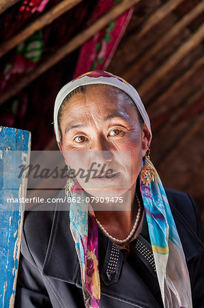 China, Xinjiang, Karakul lake. Kyrgyz woman inside her yurt (MR)
