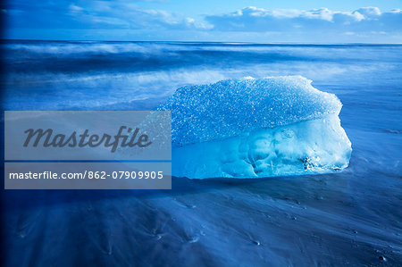 Iceland, Jokulsarlon. Frozen iceberg washed up on the black beach at Jokulsarlon.