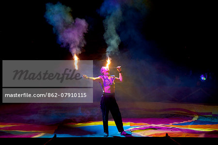 Italy, Sicily, Enna. Flame eater during his act in a Circus.