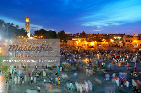 Koutoubia minaret at dusk and Djemaa el-Fna Square. Marrakech, Morocco