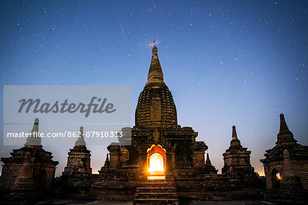 Myanmar, Mandalay division, Bagan. Buddhist pagoda at night under starry sky