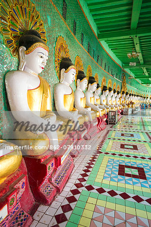 Myanmar, Mandalay.  Sagaing Hil, Buddha statues inside Umin Thounzeh temple.