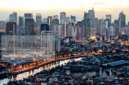 Asia, South East Asia, Philippines, Manila, Intramuros, view of Makati, the business district and the Pasig river at dusk