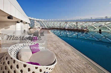 Grid shell, seat and swimming pool detail of the Yas Viceroy Abu Dhabi Hotel designed by the architects Asymptote Architecture in Yas West, Abu Dhabi, United Arab Emirates.