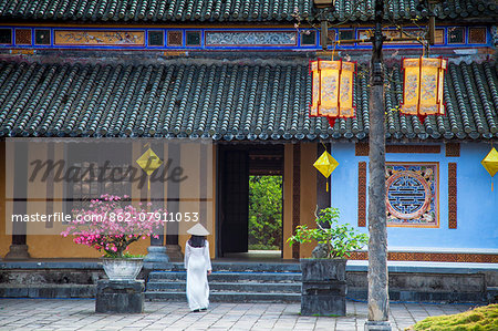 Woman wearing Ao Dai dress at Left House inside Citadel, Hue, Thua Thien-Hue, Vietnam (MR)