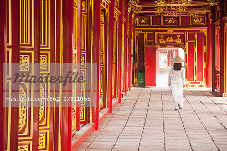 Woman wearing Ao Dai dress in Imperial Palace inside Citadel, Hue, Thua Thien-Hue, Vietnam (MR)