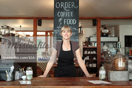 Portrait of female shop assistant in country store cafe