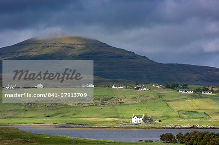 White croft cottages nestled in hamlet by mountain and Loch Vatten under grey clouds at Roag, Isle of Skye, Inner Hebrides and Western Isles, Scotland, United Kingdom, Europe White croft cottages nestled in hamlet by mountain and Loch Vatten under grey clouds at Roag, Isle of Skye, Inner Hebrides and Western Isles, Scotland, United Kingdom, Europe