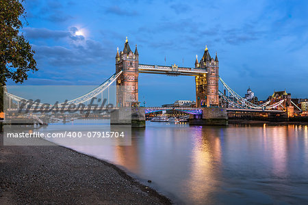 Tower Bridge and Thames River Lit by Moonlight at the Evening, London, United Kingdom