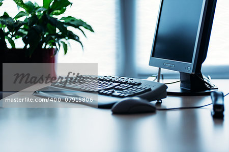 Computer on a desk in bright modern office