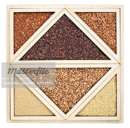 variety of gluten free grains (red and black quinoa, buckwheat, brown rive, amaranth and millet) in a wooden tray