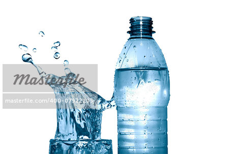 Glass of splashing water near plastic bottle on white background. Clipping path is included