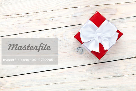 Valentines day background with gift box over white wooden table background
