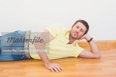 Man lying on floor at home in the living room