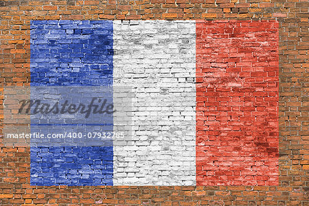 Flag of France painted over aged brick wall