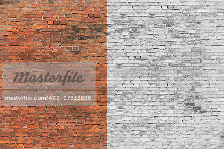 Old brick wall half-painted in white