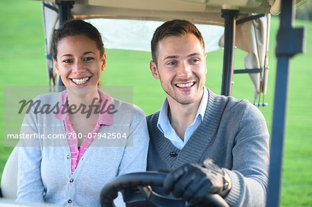 Couple in Golf Cart on Golf Course in Autumn, Bavaria, Germany