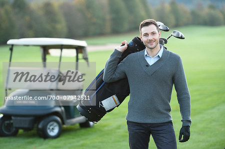 Portrait of Man Playing Golf on Golf Course in Autumn, Bavaria, Germany