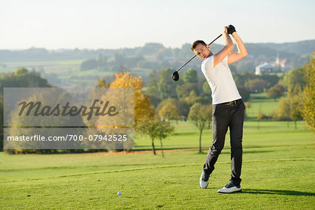 Man Playing Golf on Golf Course in Autumn, Bavaria, Germany