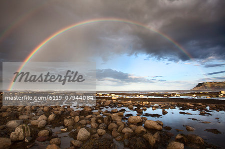 Rainbow over the sea at Robin Hoods Bay, Yorkshire, England, United Kingdom, Europe