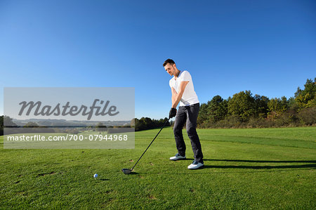 Man Playing Golf on Golf Course in Autumn, Bavaria, Germany