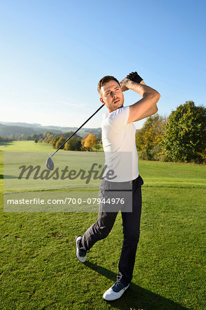 Man Playing Golf on Golf Course in Autumn, Bavaria, Germany