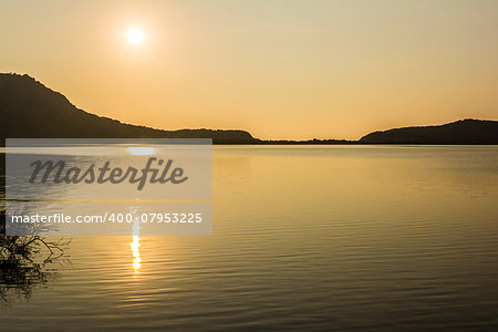 Yellow sunset on the lake