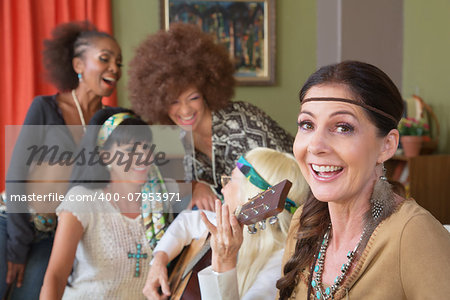 Cheerful group of five females singing 1960s folk songs