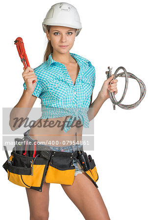 Pretty girl in helmet, shorts, shirt and tool belt with tools holding flexible hose and wrench. Isolated over white background