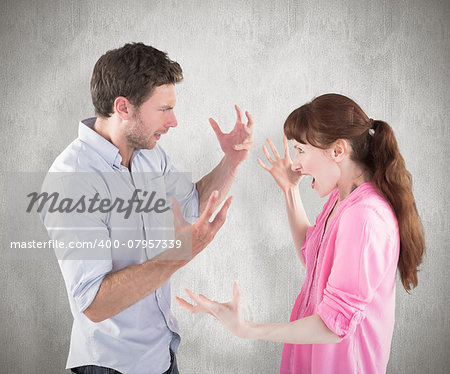 Couple arguing with each other against weathered surface
