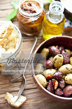 Italian antipasti: marinated olives, artichoke hearts and dried tomatoes