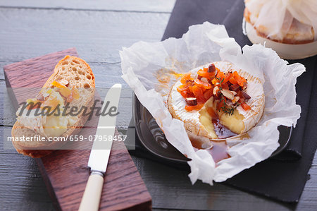 Baked Camembert with dried fruits and nuts