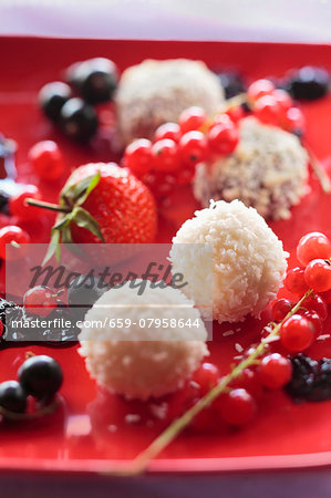 White chocolate and coconut pralines with fresh berries