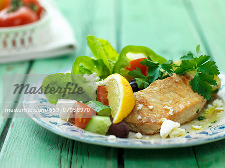 Pork escalope with a Mediterranean salad