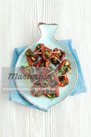 Dried tomatoes filled with capers, anchovies and parsley Dried tomatoes filled with capers, anchovies and parsley