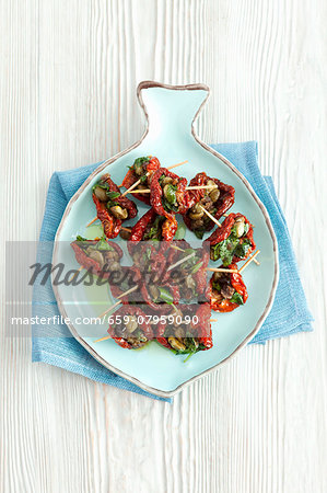 Dried tomatoes filled with capers, anchovies and parsley