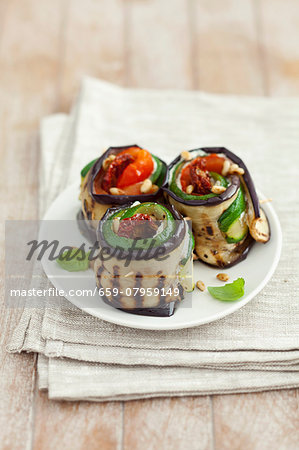 Grilled aubergine and courgette rolls filled with dried tomatoes and cream cheese