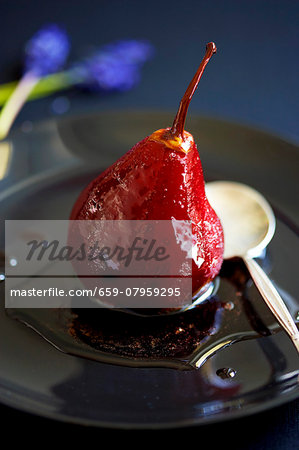 A poached pear in red wine