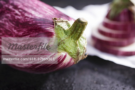 Striped aubergines, whole and sliced
