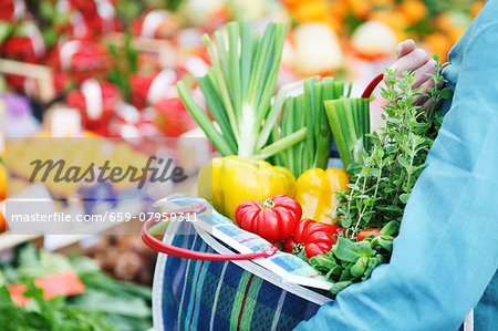 Fresh vegetables in a checked shopping bag