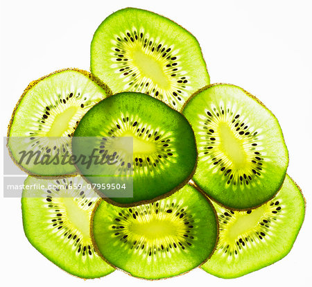 Back lit slices of kiwi Back lit slices of kiwi
