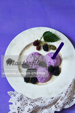 Blackberry ice cream with blackberries and blackberry leaves Blackberry ice cream with blackberries and blackberry leaves