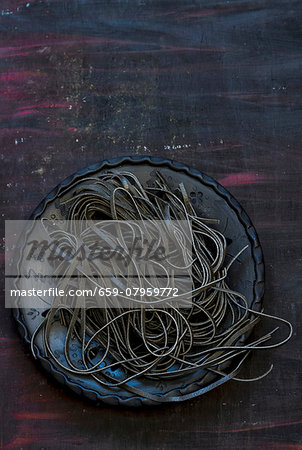 Black tagliatelle on a plate Black tagliatelle on a plate