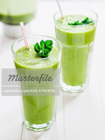 Green smoothies garnished with parsley