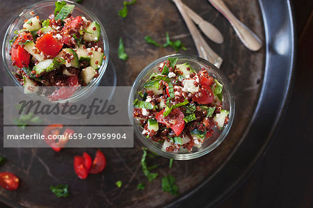 Salad with red quinoa, tomatoes, cucumber, feta cheese and mint
