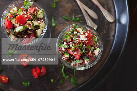 Salad with red quinoa, tomatoes, cucumber, feta cheese and mint Salad with red quinoa, tomatoes, cucumber, feta cheese and mint