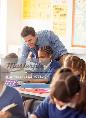 Teacher with his pupils in classroom